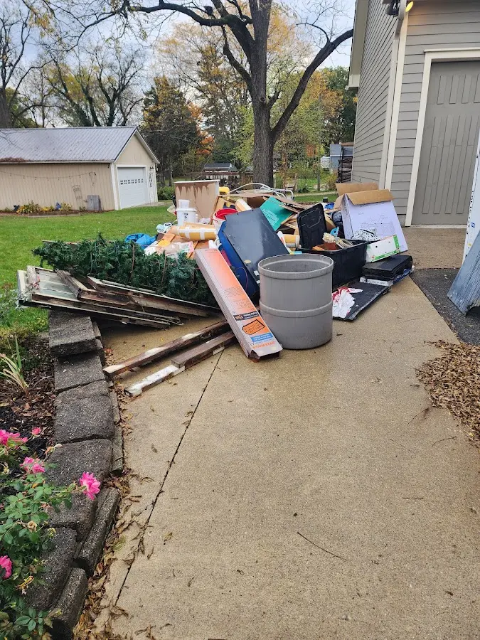 Dumpster being loaded with debris for 30 Yard Dumpster Rental in Delmar